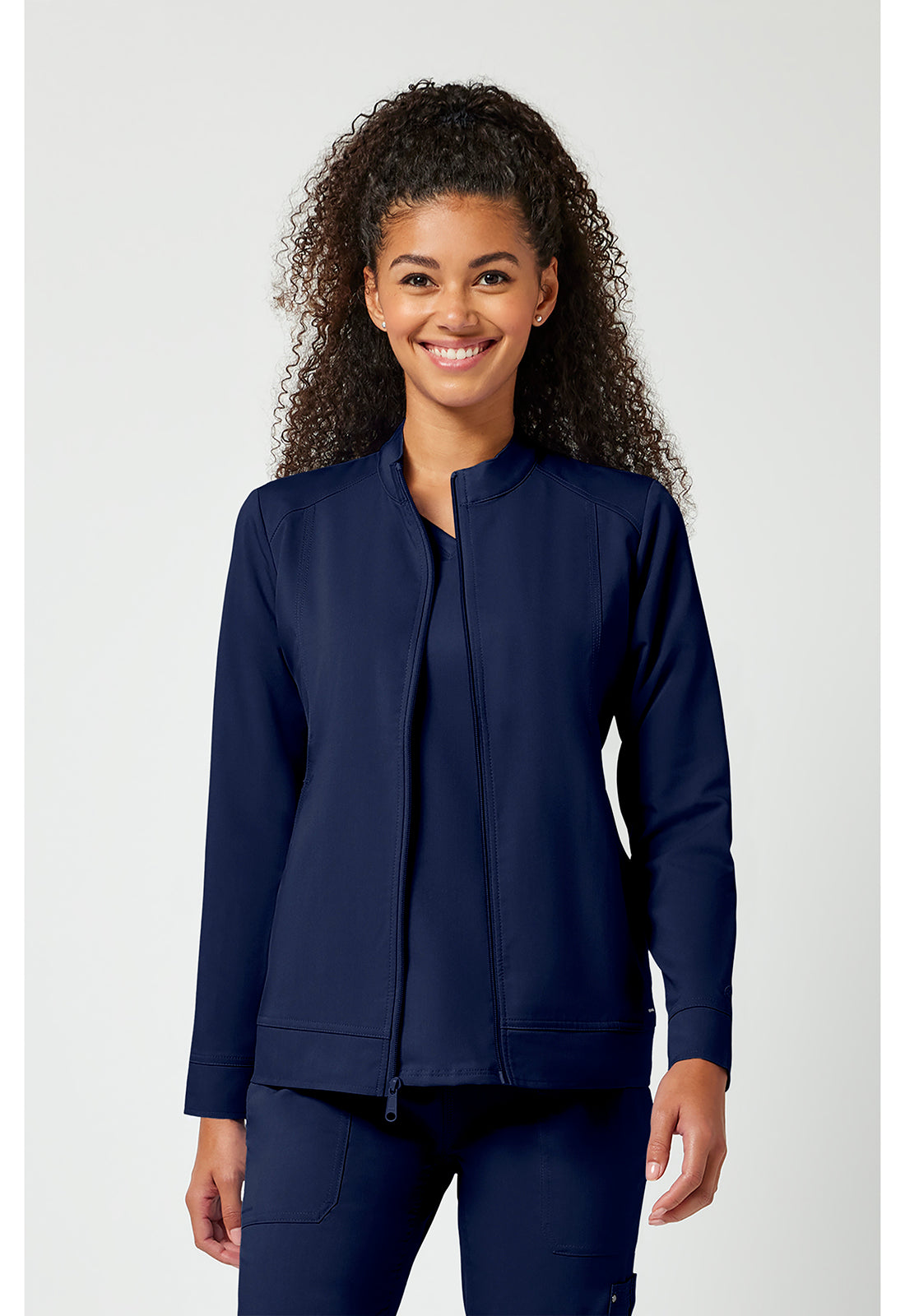 Woman wearing a navy blue jacket on a white background