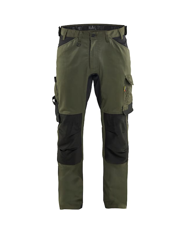 Green and black work pants on a white background