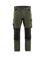 Green and black work pants on a white background
