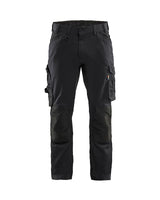 Black cargo pants with multiple pockets on a white background