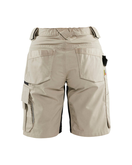Beige cargo shorts with multiple utility pockets, shown from the back on a white background.