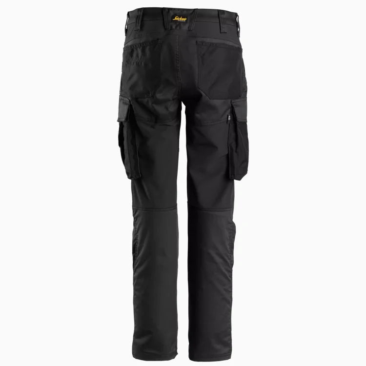 Back view of women's slim fit work trousers in grey, highlighting the contoured waistband and 4-way stretch panels for flexible movement.