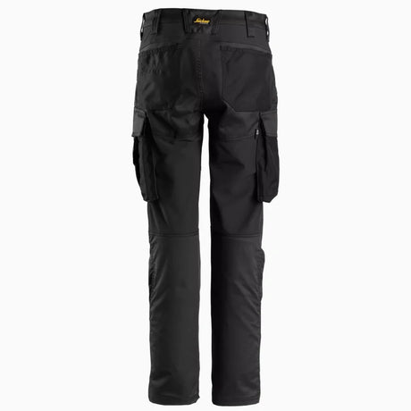 Back view of women's slim fit work trousers in grey, highlighting the contoured waistband and 4-way stretch panels for flexible movement.