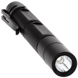 The NightStick MTU-106 illuminating hidden security markings on a document using its 365nm UV beam.