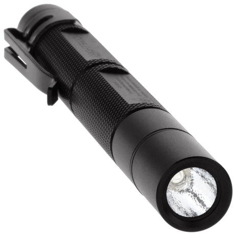 The NightStick MTU-106 illuminating hidden security markings on a document using its 365nm UV beam.