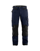 Navy and black work pants with multiple pockets on a white background