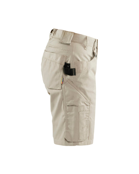 Beige cargo shorts with multiple utility pockets, shown from a side profile view on a white background.